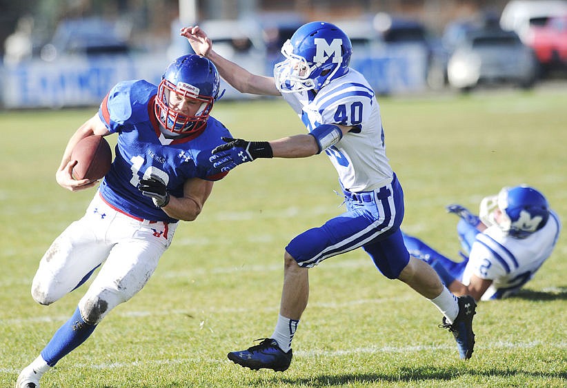 &lt;p&gt;Bigfork quarterback Josh Sandry sheds Malta&#146;s Ostin Welch as he rushes for 34 yards and a touchdown in the first quarter of Saturday&#146;s Class B football playoff game in Bigfork. (Aaric Bryan/Daily Inter Lake)&lt;/p&gt;