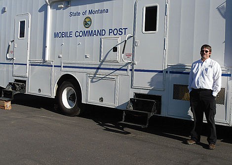 The driver poses outside the Mobile Command Post that arrived unannounced at Dr. Annie Bukacek&#146;s office, carrying government investigators who interviewed staffers and copied office documents and patient health care records from Hosanna Health Care.