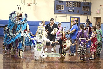 &lt;p&gt;Ben Corral, right, and his son, Willie Pierre, left, drum while dancers perform the Happy Dance.&lt;/p&gt;