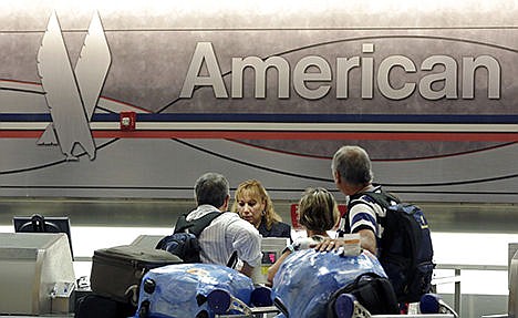 &lt;p&gt;Passengers check in at the American Airlines counter at Miami International Airport in Miami on May 27.&#160;&lt;/p&gt;