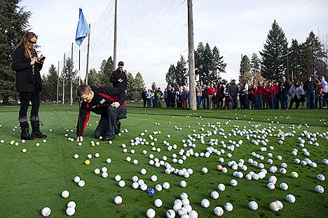 &lt;p&gt;Jessica Bonar and Michael Harrington declare the winner of Coeur d&#146;Alene Charter Schools&#146;s annual fundraiser the Golf Ball Drop at Avondale Golf Course on Saturday morning. A helicopter dropped 691 golf balls onto Avondale Golf Course and the closest to the hole won $1,000. All proceeds are used to purchase instruments for the Coeur d&#146;Alene Charter School band and orchestra programs&lt;/p&gt;
