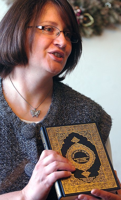 Kathy Garber shows a qur'an given to her by a Molana Syed Muhammad Abd-ul-Khabir Azad on a recent trip to Pakistan with the organization Global Mission Awareness.