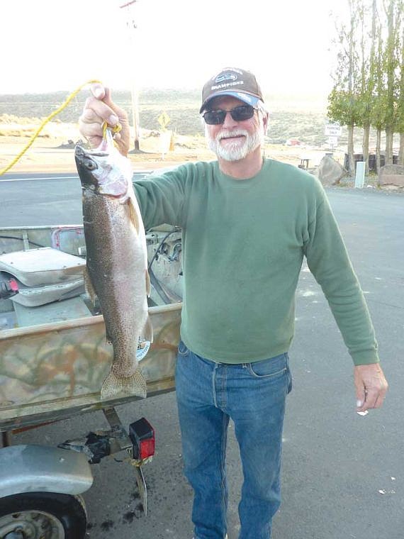 Ron Oakland, Moses Lake Resident, shows his 7lb Rainbow caught on a Rapala Shad Rap trolling at the east end of O'Sullivan Dam.