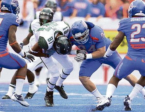&lt;p&gt;Boise State linebacker Byron Hout (94), a former Lake City standout, puts a hit on Hawaii wide receiver Royce Pollard (81) in the first quarter during a game Saturday at Bronco Stadium in Boise. Hout and BSU will face the Idaho Vandals for the final time as conference rivals on Friday in Moscow.&lt;/p&gt;