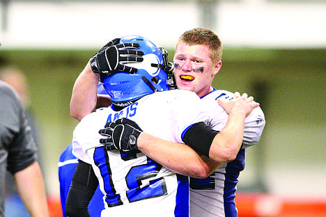 &lt;p&gt;Gunnar Amos, and Jeremiah Hazard celebrate after Coeur d'Alene's win over Highland.&lt;/p&gt;