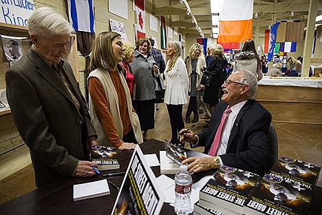 &lt;p&gt;FBI Special Agent Wayne F. Manis signs his new book The Street Agent for Greg Seguin&#160;and Nicole Olson&#160;during his reception at the Human Rights Education Institute on Saturday evening. Manis served with the FBI from 1966 until 1994.&lt;/p&gt;