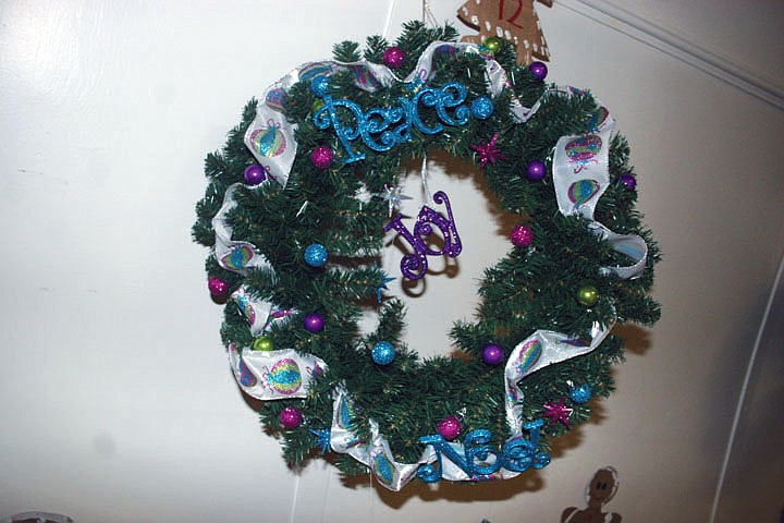 This wreath uses brighter colors to bring about the feelings of the Christmas season.