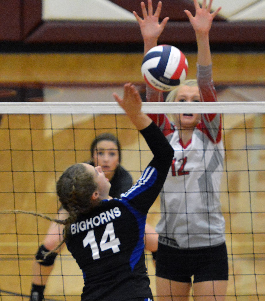 &lt;p&gt;ARLEE HIGH School volleyball player Carly Hergett attempts a block against a Lone Peak defender in the first match of the Class-C Divisional volleyball touranment Thursday at the MAC-Center in Butte.&lt;/p&gt;