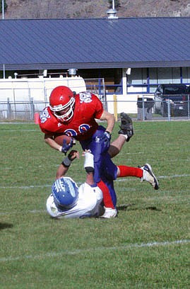 Darian Haberlock doesn't let a man from Fairfield disrupt him as he psuhes past the opponent and looks for an opening to move the ball downfield.