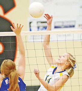 <p>Senior Lauren Wepprecht winds up a kill in her last-ever high school game, a 3-0 loss to the Columbia Falls Wildkats.</p>