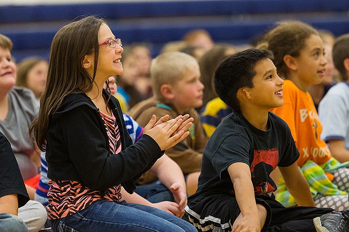 &lt;p&gt;Third grade students at Bryan Elementary Summer Branting claps as Xavier Gayton laughs during Kenn Nesbitt&#146;s writing presentation.&lt;/p&gt;