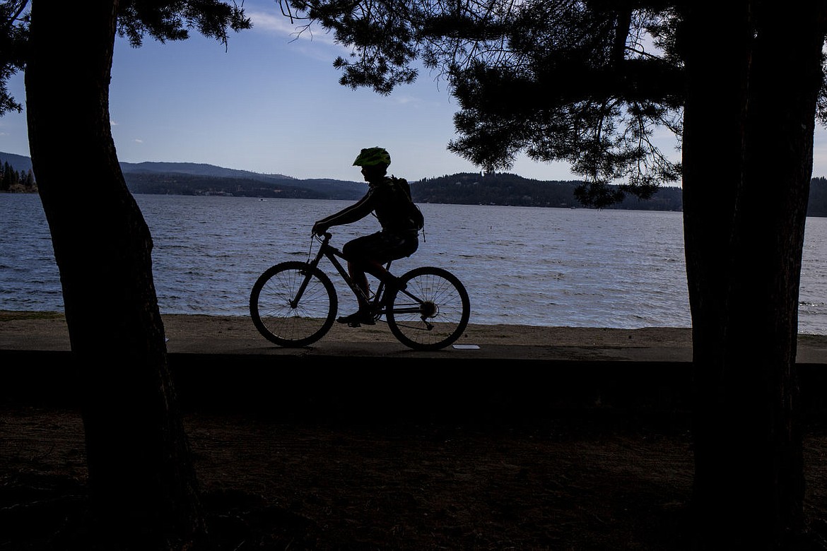 &lt;p&gt;A boy rides his bike in Coeur d'Alene City Park on Sept. 1.&lt;/p&gt;