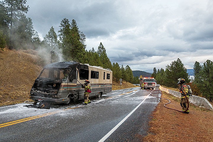 &lt;p&gt;Crews with the Coeur d&#146;Alene Fire Department and Kootenai County Fire and Rescue work to extinguish a motor home that caught fire while being driven uphill on West Upriver Drive Monday south of Coeur d&#146;Alene. The driver of the RV was the single occupant and was not reported to have been injured. The cause of the blaze is under investigation.&lt;/p&gt;