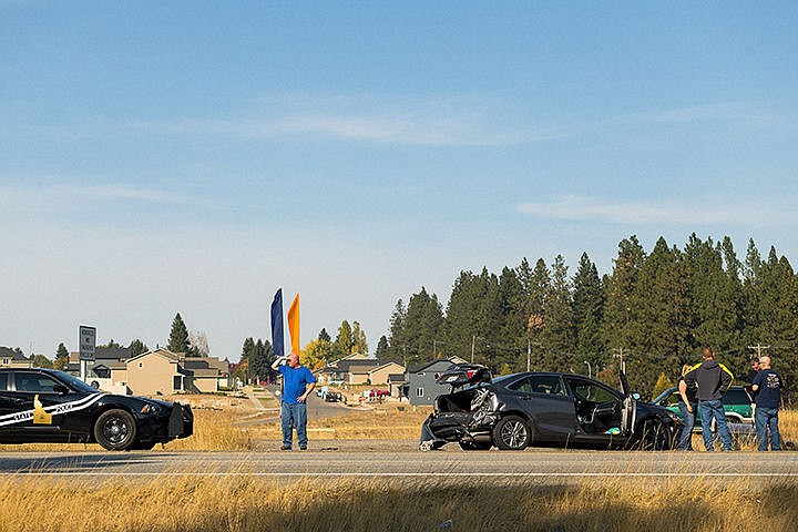 &lt;p&gt;Witnesses and involved parties gather near the median of Interstate-90 Monday after a two-car collision near mile-marker 11 in Coeur d&#146;Alene. Idaho State Police responded to the scene and the cause of the accident is under investigation.&lt;/p&gt;