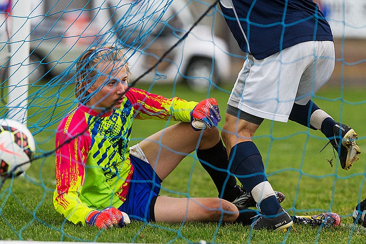 &lt;p&gt;Shawn McKeeken, Coeur d&#146;Alene High School goal keeper, falls to the ground during a first half score by Lake City on Thursday.&lt;/p&gt;