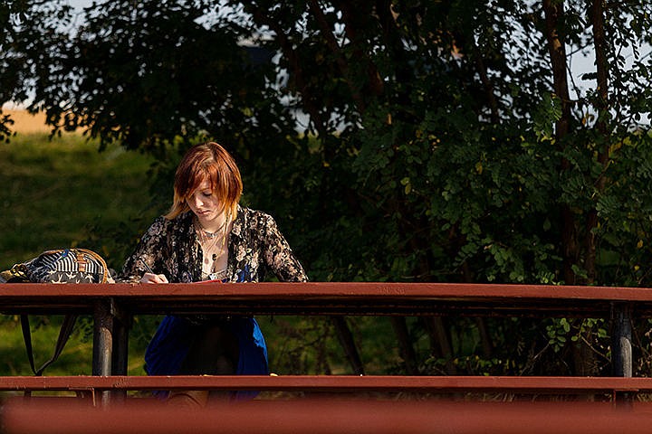 &lt;p&gt;Leah Branscone, a 19-year-old freshman business student at North Idaho College, works on an essay on a sunny Monday afternoon between the Spokane River and college campus in Coeur d&#146;Alene.&lt;/p&gt;