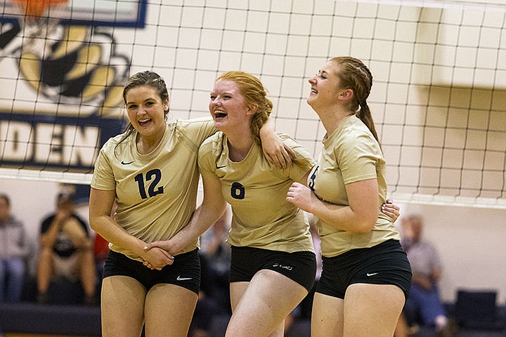 &lt;p&gt;From left, Mataraca Rocheleau, Gloria Cheevers and Courtney Eaton celebrated after a block by Cheevers during the second set Wednesday in Spirit Lake.&lt;/p&gt;