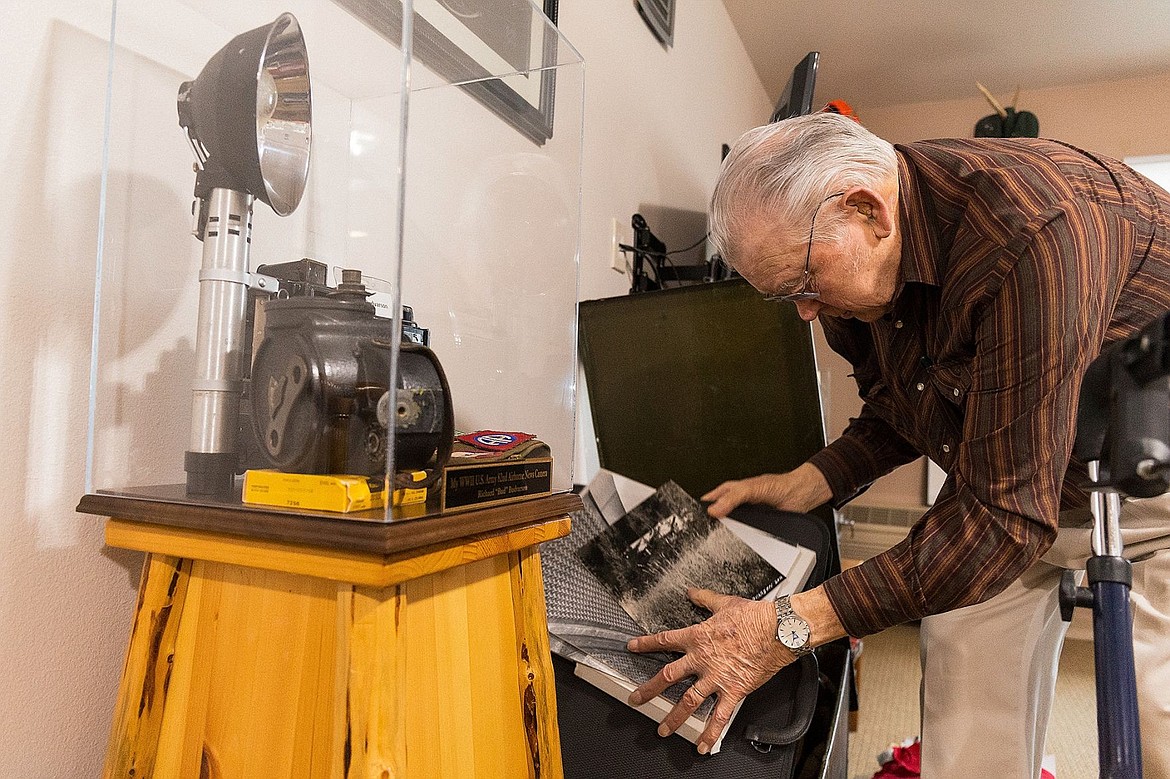 &lt;p&gt;&#160;Bud Budvarson digs through an original Army-issues trunk looking for photography gear that was used during his service between 1944 and 1947.&lt;/p&gt;