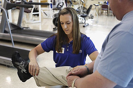 &lt;p&gt;In this May 12 photo, Tara Holycross works with a patient at Beloit Health System Occupational Medicine and Sports Medicine in Beloit, Wis. Holycross grew up in Danville, Ill., but moved away after college to find greater job opportunities.&#160;&lt;/p&gt;