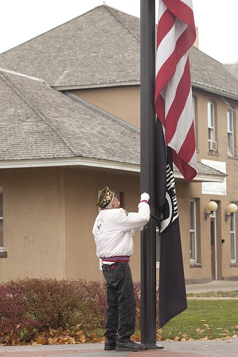 &lt;p&gt;Henry Fettler raises the flag at the start of the Veterans Day
ceremony at Depot Park in Kalispell Friday morning.&lt;/p&gt;