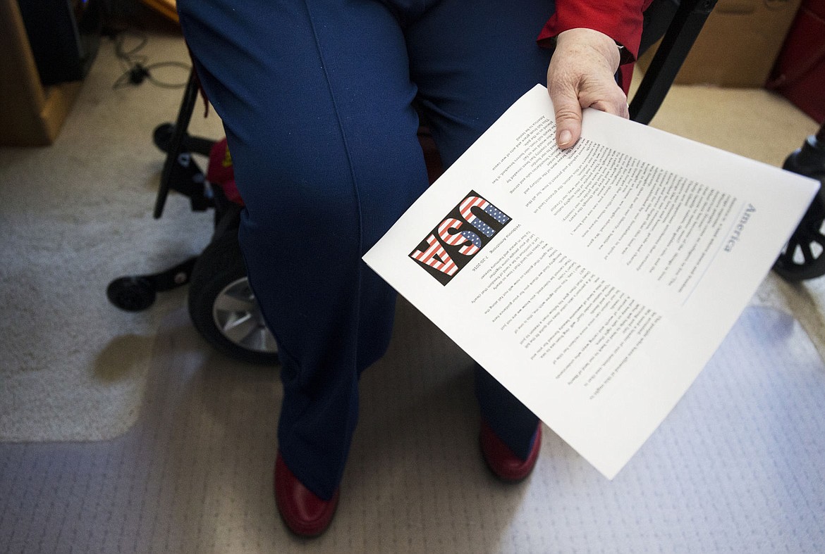 &lt;p&gt;Veldonna Armstrong, 77, reads her poem, &quot;America,&quot; before Garden Plaza's Veterans Day event on Thursday.&lt;/p&gt;