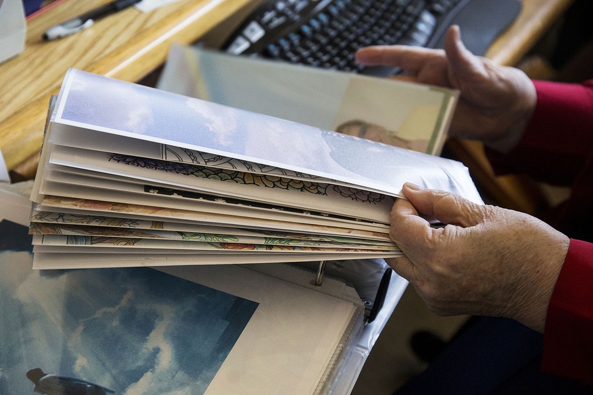 &lt;p&gt;Garden Plaza resident Veldonna Armstrong sifts through poems to read.&lt;/p&gt;