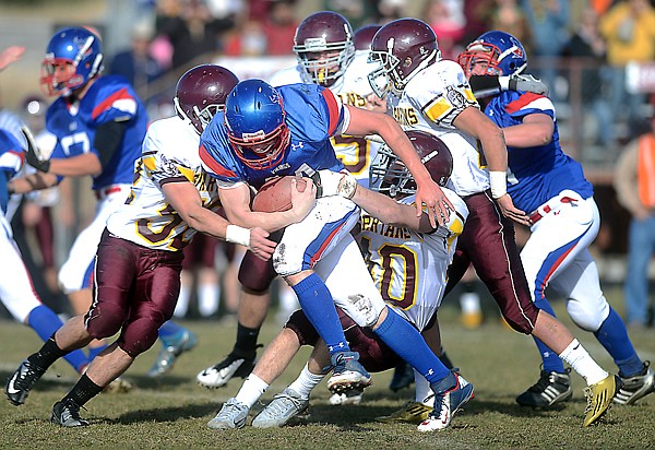 &lt;p&gt;Bigfork junior running back Vinny Quirk (center) is tackled by a host of Baker defenders during Saturday&#146;s Class B quarterfinal playoff game in Bigfork.&#160;&lt;/p&gt;