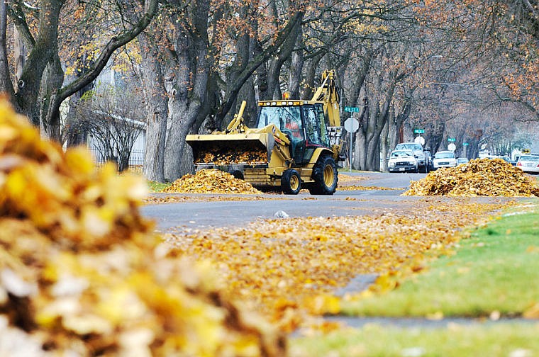 &lt;p&gt;A front-end loader piles up leaves Wednesday afternoon on Fifth Avenue East in Kalispell. (Patrick Cote/Daily Inter Lake)&lt;/p&gt;