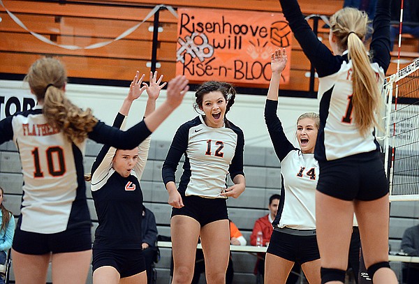 &lt;p&gt;Iris Matulevich (2), Lizzie Sherwood (12), Timi Severson (14) and others celebrate during the volleyball game between Flathead and Big Sky on Thursday, November 7, in Kalispell. (Brenda Ahearn/Daily Inter Lake)&lt;/p&gt;