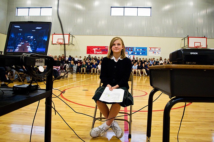 &lt;p&gt;Third-grader Haley Donovan listens to active duty United States military personnel from the Gulf Region District base in Baghdad after asking questions about base life via Skype transmission during a Veterans Day ceremony at Holy Family Catholic School.&lt;/p&gt;