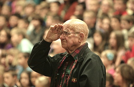 &lt;p&gt;Post Falls' Steve Frazey, an Air Force veteran who served during the Korean War, stands and acknowledges singing by the Ponderosa Elementary choir on Monday.&lt;/p&gt;