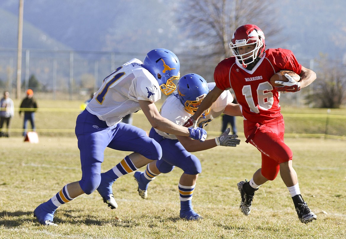 &lt;p&gt;Arlee's Isaac Desjarlais gets around two Wibaux defenders on Saturday afternoon in Arlee.&lt;/p&gt;