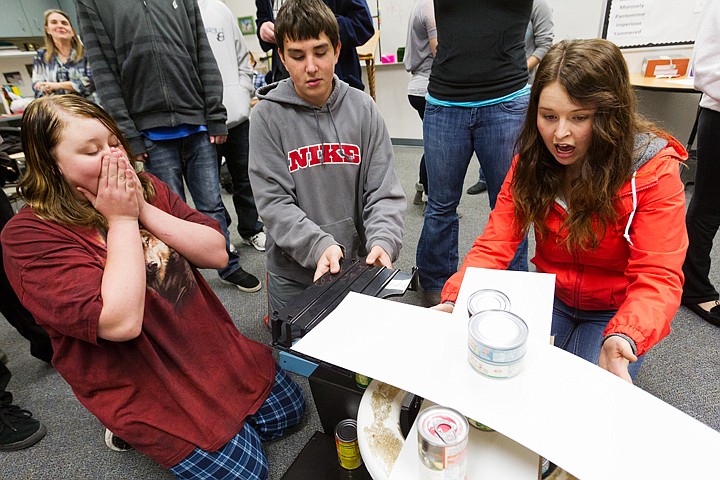 &lt;p&gt;SHAWN GUST/Press Senior Josie Lindblad, far right, balances a structure as Dominic Walters adds props and Zoe Capes, left, reacts to the unstable creation of cans of food and other materials Thursday during a peer mentoring activity in a freshman English class at Lake City High School. The activity was part of a food drive that will benefit Lake City Community Church's food bank. Some 500 students and staff contributed to the effort.&lt;/p&gt;