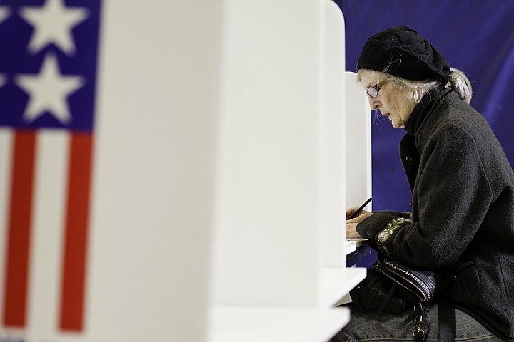 &lt;p&gt;SHAWN GUST/Press Geri Rogers fills in her ballot at Sorensen Magnet School.&lt;/p&gt;