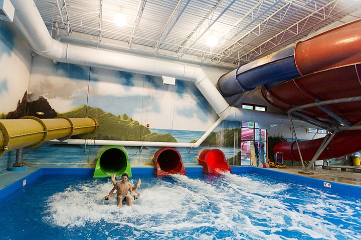 &lt;p&gt;SHAWN GUST/Press Alex Mays, 15, of Sandpoint, hangs on to his tube as he splashes into the pool with a friend while visiting Raptor Reef Indoor Waterpark's new Constrictor Slide Friday at Triple Play Family Fun Park in Coeur d'Alene. The new 340-feet long slide is the first slide of its type in the Northwest and was recently highlighted on the Travel Channel as one of the world's most extreme slides.&lt;/p&gt;