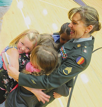 &lt;p&gt;Linderman Elementary School teacher and retired Army Stf. Sgt. Mona Friday gets a hug from her students after the school&#146;s salute to the military.&#160;&lt;/p&gt;