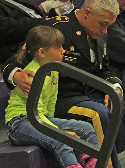 &lt;p&gt;A veteran hugs a young girl during an invocation at Linderman's veterans salute.&lt;/p&gt;