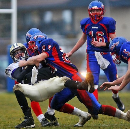 Bigfork's Cody Dopps (25) takes down Cut Bank's Dylan Smith.