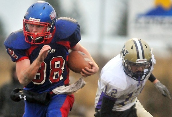 Bigfork's Ian Lorang (88) returns an interception in the fourth quarter.