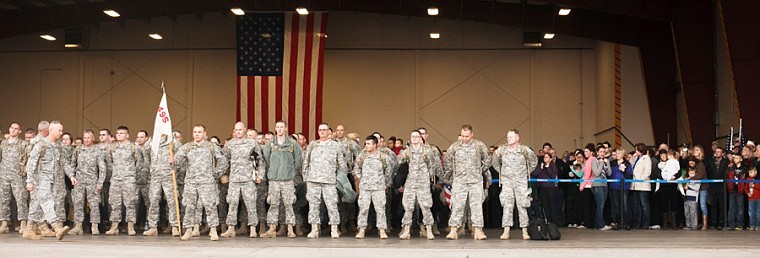 &lt;p&gt;Patrick Cote/Daily Inter Lake Family and friends look on as members of the Montana National Guard's 495th Combat Sustainment Support Battalion line up in formation Tuesday morning during the deploying from the Glacier Jet Center at Glacier International Airport. Tuesday, Nov. 6, 2012 in Kalispell, Montana.&lt;/p&gt;