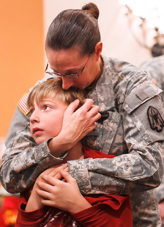 &lt;p&gt;Patrick Cote/Daily Inter Lake Sgt. Aimee Schmidt embraces her son Colton, 8, Monday afternoon after the deployment ceremony for the Montana National Guard 495th at the Hilton Garden Inn. The 495th leaves for Afghanistan on Tuesday. Monday, Nov. 5, 2012 in Kalispell, Montana.&lt;/p&gt;