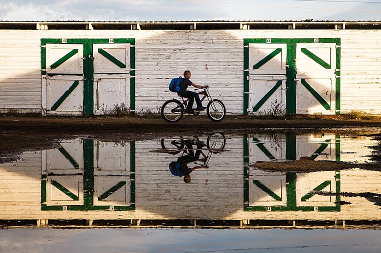 &lt;p&gt;Jordan Burow, 13, rides his bike past a puddle Tuesday afternoon at the Flathead County Fairgrounds in Kalispell.&lt;/p&gt;