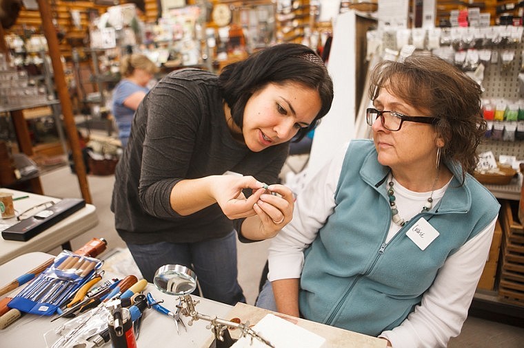 &lt;p&gt;Mara Haggar, left, shows Louise Barker where the edge of the bezel of her ring should end Oct. 21 during a copper cabochon ring class taught at Powder Horn Trading Company.&lt;/p&gt;