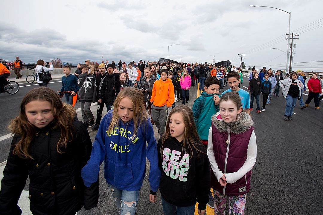 &lt;p&gt;JAKE PARRISH/Press More than 500 people of all ages walk across the Greensferry Overpass to mark its official opening on Thursday in Post Falls. The bridge will link north and south Post Falls for cars and pedestrians.&lt;/p&gt;