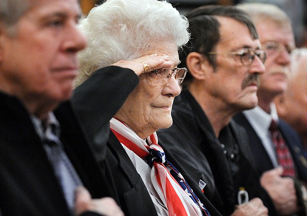 Irene Hansen of Whitefish salutes as the National Anthem is played on Thursday at the Veterans Day Ceremony in Whitefish. Hansen served in the United States Coast Guard.