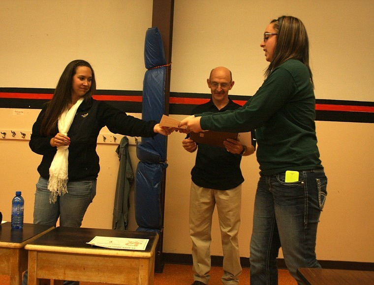 &lt;p&gt;Junior varsity coach Whitney Tanner-Spurr and coach Earhart hand out an award to Jessica Hansen for the award for the most kills.&lt;/p&gt;