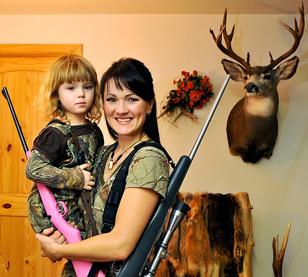 Angie's daughter Quin, 4, received her gun (pictured) on her first birthday. While she isn't old enough to go hunting for deer just yet, her family lets her shoot at stumps and pop cans for the time being.