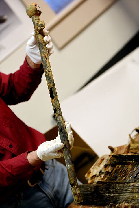 <p>Executive Director of the Northwest Montana Historical Society Gil Jordan displays the a flag pole, one of the items recovered from the sunken remains of the Kee-O-Mee. (Brenda Ahearn/Daily Inter Lake)</p>