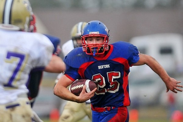 Bigfork's Cody Dopps (25) carries the ball toward the end zone just before halftime of Saturday's Class B semifinal game in Bigfork.