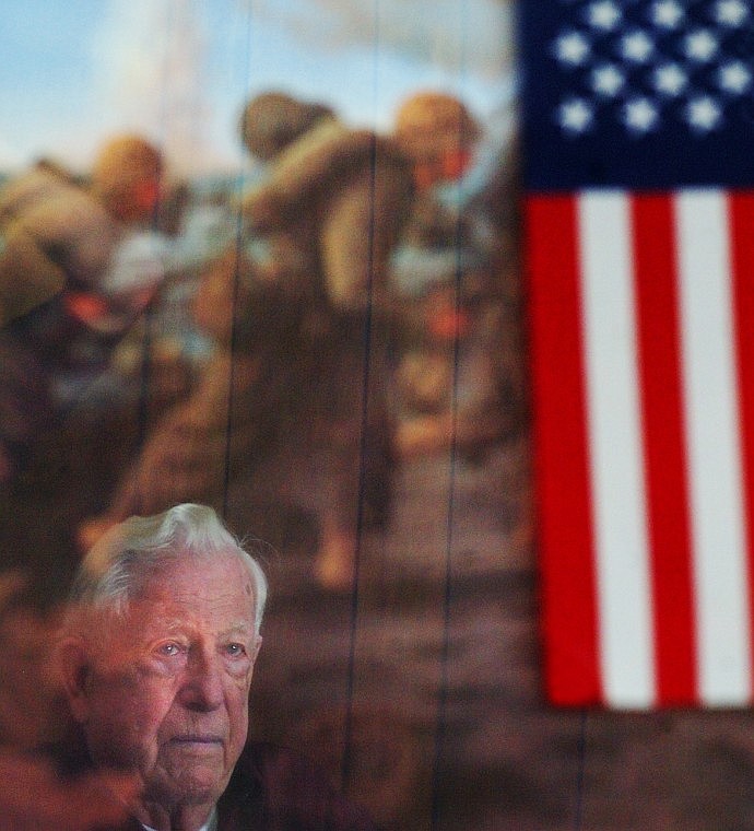 Lester Smith of Kalispell is reflected in Col. D.J. Neary&#146;s painting, &#147;Iwo Jima &#151; 19 February 1945.&#148; Smith, who enlisted in the Marines following the attack on Pearl Harbor, spent 36 days in a foxhole during the vicious fighting on Iwo Jima in 1945.